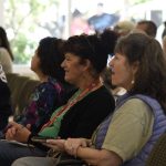 Folks gathering in the Parish Hall enjoying a presentation.