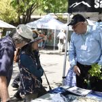 Folks talking together at the Indigo Natural Dyes table