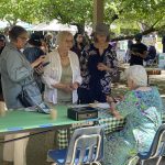 Women talking on the patio during EarthFest