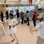 Khalilah Ramirez leading people in the Dance of Peace