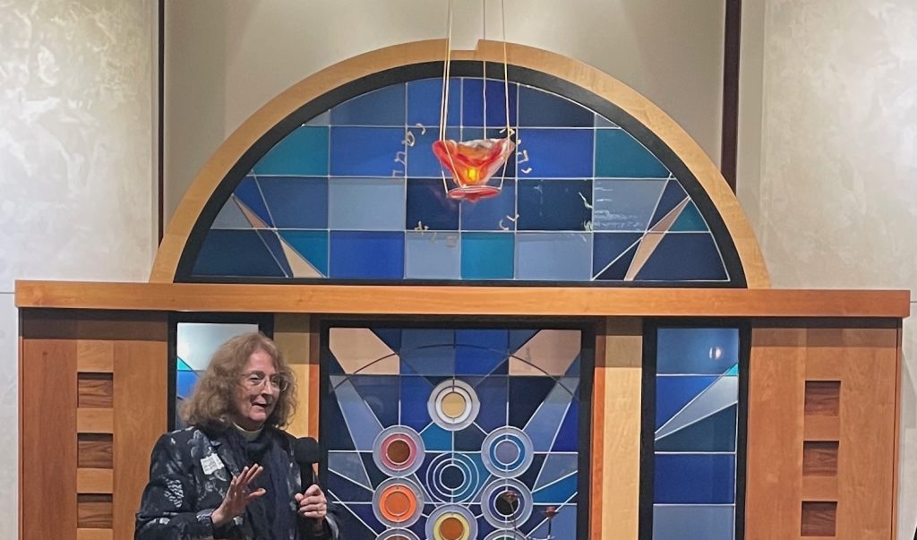 The Rev Susan Geissler-O'Neil of Saint Timothy's Episcopal Church speaking in Beth Chaim's Sanctuary.